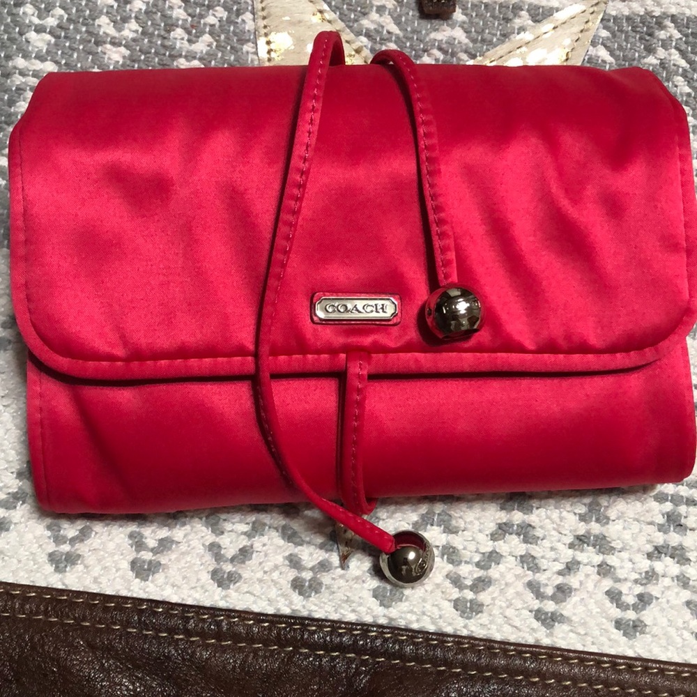 Coach jewelry roll. Pink